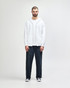 A white Gildan Heavy Blend full zip hooded sweatshirt worn with black pants and sneakers, featuring a front pouch pocket.