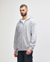 A grey Gildan Heavy Blend adult full zip hooded sweatshirt, featuring a logo and front pockets.