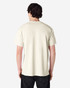 A plain beige adult T-shirt is displayed, featuring a crew neck and short sleeves. It has a logo on the back.