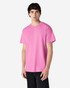 A pink Gildan Ultra Cotton adult t-shirt displayed on a model, featuring short sleeves and a basic cut.