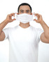 A person wearing a white t-shirt holds a white non-medical grade mask in front of their face.