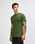 A model wearing an olive green unisex fine jersey short sleeve t-shirt, posed in profile.