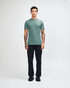 A unisex fine jersey short sleeve t-shirt in teal, paired with beige cargo pants, worn by a model.