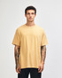 A unisex heavyweight cotton t-shirt in a soft yellow colour, featuring a relaxed fit and short sleeves.