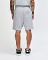Grey unisex gym shorts with an elastic waistband and a back pocket, featuring a logo. 