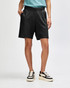 Unisex black pique gym shorts with an elastic waistband and side pockets, featuring a logo.