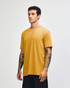 A unisex short sleeve t-shirt in a rich mustard yellow colour, featuring a logo on the front.