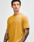 A unisex short sleeve t-shirt in a mustard yellow colour, featuring a simple design and a logo.