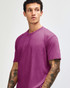 A unisex short sleeve t-shirt in a vibrant magenta colour, worn by a model with a neutral expression.