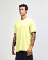 A unisex CVC short sleeve t-shirt in bright yellow, displayed on a model against a neutral background.
