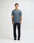 A short sleeve unisex t-shirt in a blue shade, paired with black cargo pants, featuring a logo.