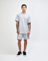 A grey unisex pique mockneck T-shirt with short sleeves and a standard fit. It features a logo on the garment.