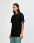 A black unisex pique mockneck T-shirt displayed on a model, featuring short sleeves and a slight mock neckline.