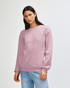 A unisex crewneck sweatshirt in light pink, featuring a relaxed fit and long sleeves. It has a logo on the front.