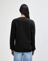 A unisex crewneck sweatshirt in black, featuring long sleeves and a relaxed fit, with a logo on the back.