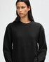 A black unisex crewneck sweatshirt with long sleeves, featuring a logo on the front.