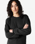 A black long sleeve t-shirt displayed on a model with curly hair, featuring a logo on the garment.