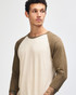 A unisex raglan T-shirt featuring a beige body and brown sleeves, with a model displaying the shirt.