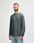 A dark navy long sleeve t-shirt is displayed on a model, featuring a logo on the sleeve.