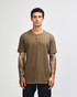 A unisex henley t-shirt in a khaki colour, featuring a round neckline and buttons, displayed on a model.