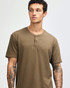 A unisex henley t-shirt in a muted brown colour, featuring a buttoned neck and short sleeves.