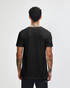 A black unisex V-neck T-shirt from American Apparel, displayed from the back with a person wearing it.