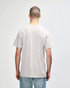 A grey Gildan Heavy Cotton adult t-shirt viewed from the back, featuring a simple design and short sleeves.