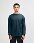 A dark blue long-sleeve t-shirt with a pocket, featuring a simple design and a logo.
