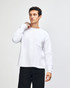 A model wearing a grey, long-sleeve American Apparel Super Heavyweight T-Shirt featuring a chest pocket.