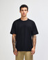 A dark navy heavyweight t-shirt displayed on a model, featuring a simple design and a logo.