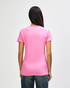 A pink Gildan Heavy Cotton Ladies' T-Shirt is displayed from the back, featuring a simple design and a relaxed fit.