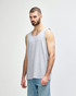 A grey Gildan Heavy Cotton adult tank top displayed on a model, featuring a plain design and a logo.