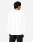 A white long sleeve t-shirt with a logo on the back, displayed on a person facing away.