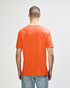 An orange adult t-shirt displayed from the back, featuring a plain design and a visible logo.