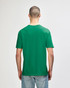 A green Gildan Softstyle adult T-shirt displayed on a person from the back, featuring a plain design.