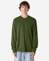An olive green long sleeve T-shirt on a model, featuring a simple design and relaxed fit. The shirt has a logo.