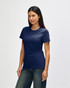 A navy blue Gildan Softstyle ladies' T-shirt displayed on a model, featuring a simple design and short sleeves.