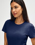 A navy Gildan Softstyle ladies' t-shirt displayed on a model, featuring a simple design and short sleeves.