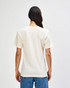 A cream-coloured American Apparel tri-blend T-shirt, viewed from the back, featuring a simple design and relaxed fit.