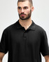 A black Gildan Softstyle adult double pique polo featuring a collared neckline and three buttons. It has a logo on the fabric.