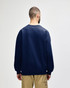 A navy Gildan Softstyle adult sweatshirt with a plain back, featuring a fitted design and long sleeves.