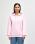 A pink hooded sweatshirt features a front pocket and a drawstring hood, modelled by a person.