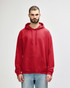 A red hooded sweatshirt with a front pocket and drawstring, featuring a logo on the chest.