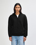 A black unisex full zip hooded sweatshirt displayed on a model. The garment features a logo.