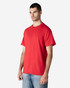 A red Gildan Light Cotton T-Shirt displayed on a model, featuring a crew neckline and short sleeves.
