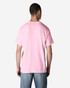 A man wearing a pink Gildan Light Cotton T-Shirt from the back, paired with denim jeans.