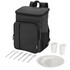 A black picnic cooler backpack with cutlery set, including plates, cups, forks, and spoons. It has a logo.