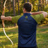 A men's active polo shirt featuring a dark blue back and a green front, designed for performance with a logo.