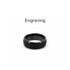 A black carbon fibre ring featuring an engraved design. The ring has a smooth, polished surface and a rounded profile.