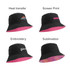 A black bucket hat with a pink underside and various promotional logos in different print styles.